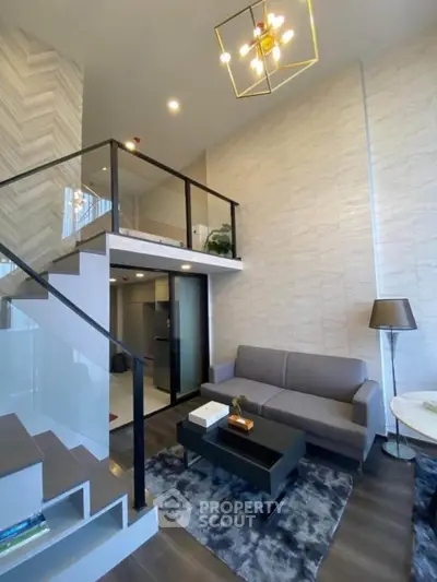 Modern loft-style living room with high ceiling and stylish decor