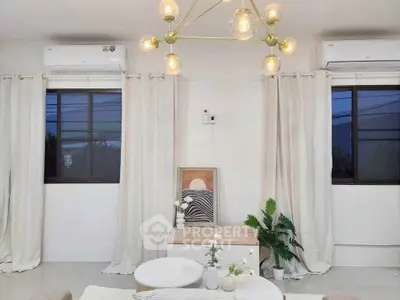 Stylish living room with modern lighting and dual air conditioning units, perfect for comfort and elegance.