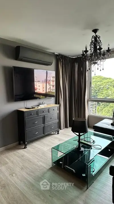 Modern living room with stylish decor and large window view