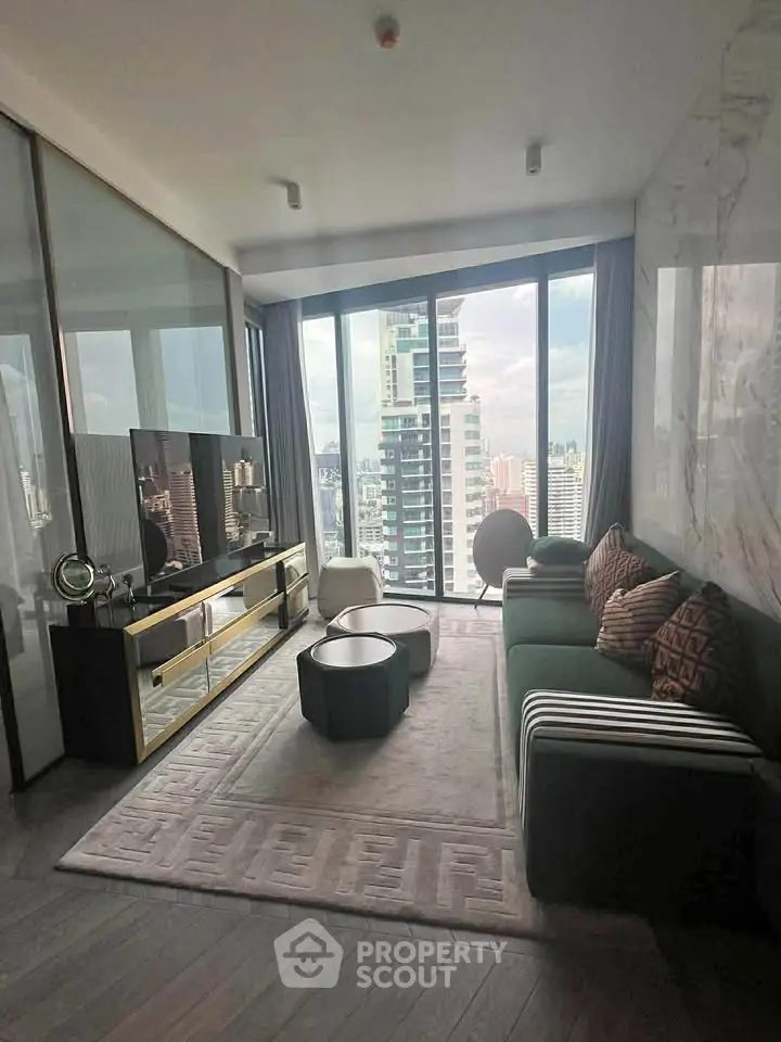 Luxurious living room with floor-to-ceiling windows offering stunning city views in a modern high-rise apartment.