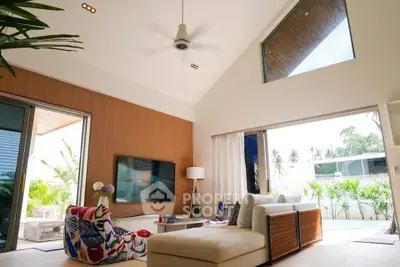 Luxurious modern living room with high ceiling and pool view, featuring stylish furniture and large windows.