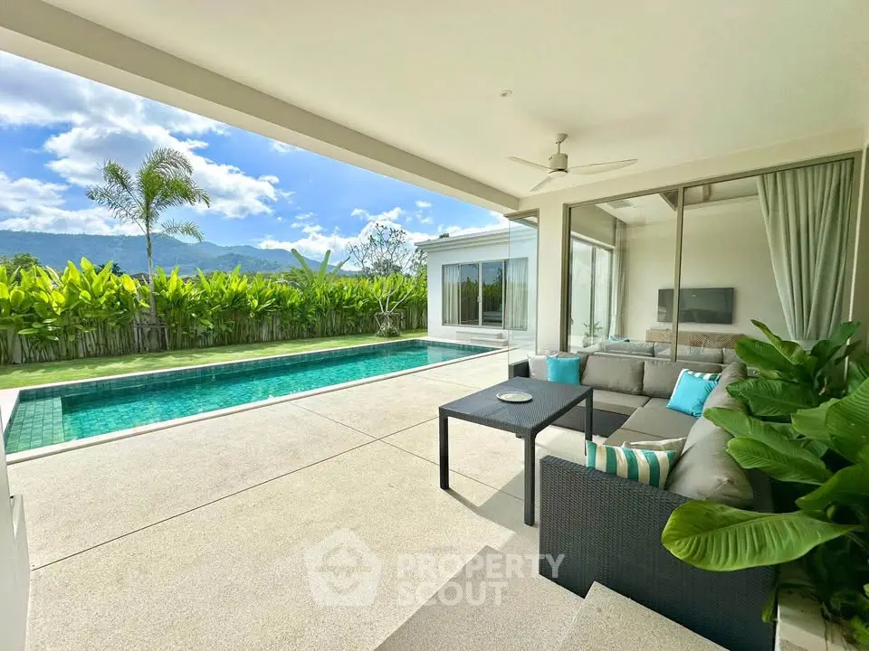 Luxurious outdoor patio with pool and mountain view, perfect for relaxation and entertainment.