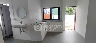 Minimalist kitchen with open layout and modern sink design
