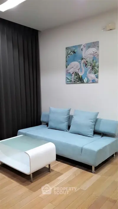 Stylish living room with modern blue sofa and elegant decor