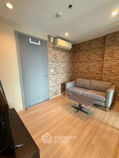 Cozy living room with brick accent wall and modern furnishings