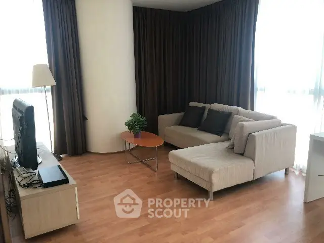 Spacious living room with modern sofa and natural light