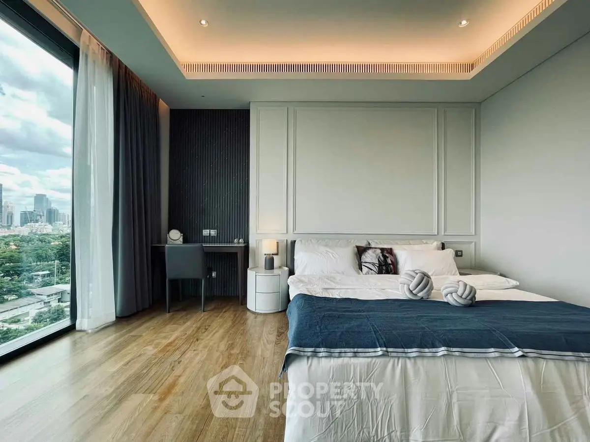 Luxurious bedroom with stunning city view and elegant decor