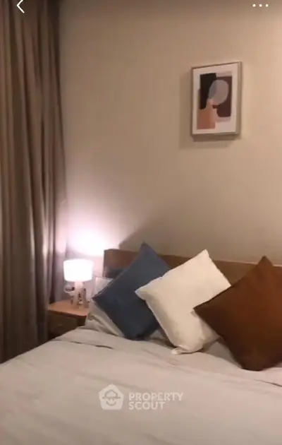 Cozy bedroom with stylish decor and soft lighting