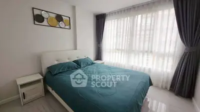 Bright and modern bedroom with large window and stylish decor