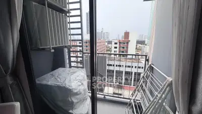 Charming urban balcony with city view, perfect for relaxation and enjoying the skyline.