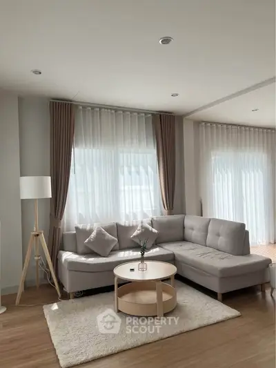 Modern living room with stylish furniture and natural light