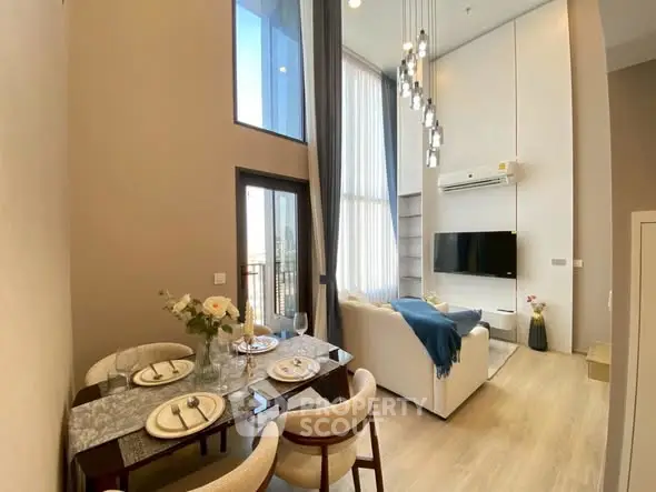 Modern living room with high ceilings and elegant dining area