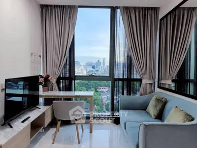 Modern living room with city view, stylish furniture, and large windows for natural light.