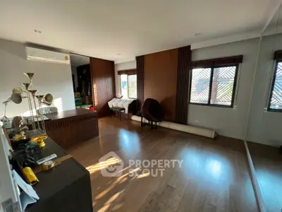 Spacious modern living room with wooden flooring and stylish decor