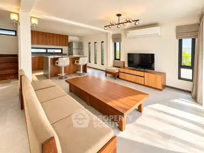 Spacious modern living room with open kitchen and stylish furnishings