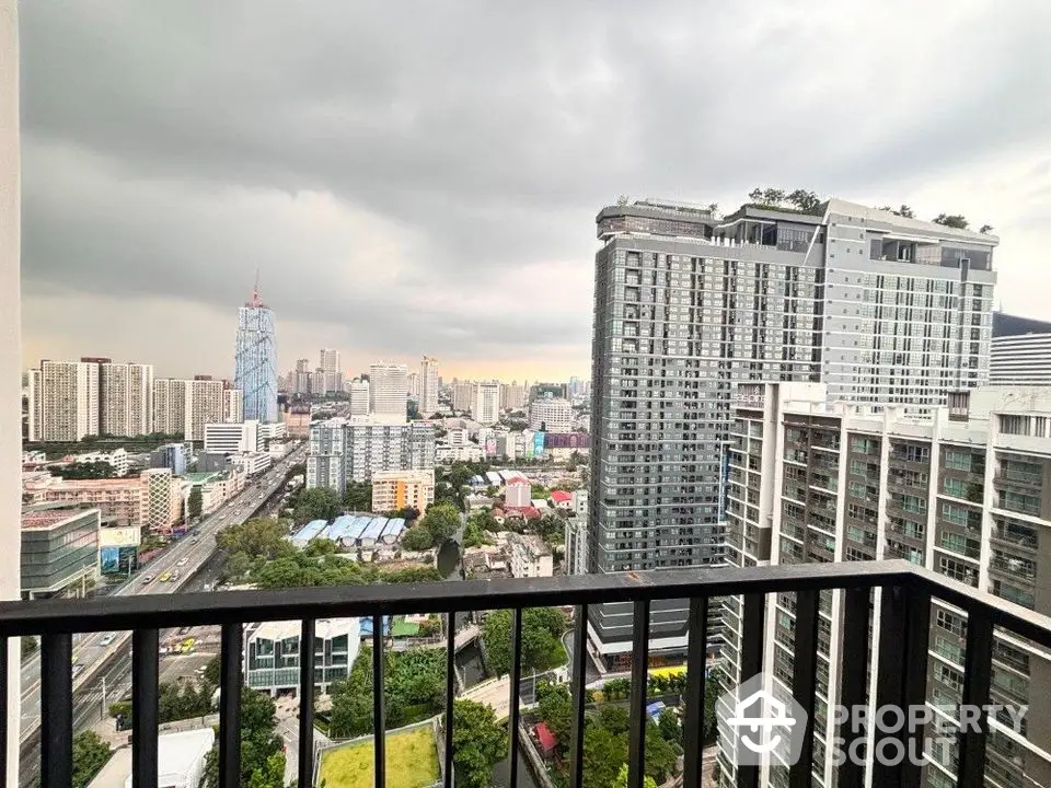 Stunning cityscape view from high-rise balcony in modern urban apartment.