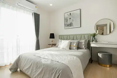 Elegant bedroom with stylish decor, featuring a plush bed, modern furniture, and natural light from large window.