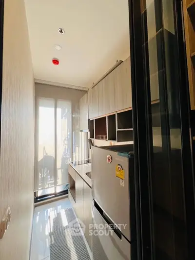 Modern kitchen with sleek cabinetry and natural light