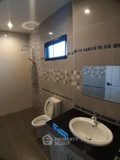 Modern bathroom with stylish tiles and sleek fixtures