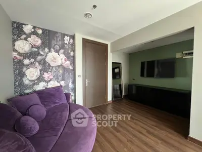 Stylish living room with floral accent wall and modern decor