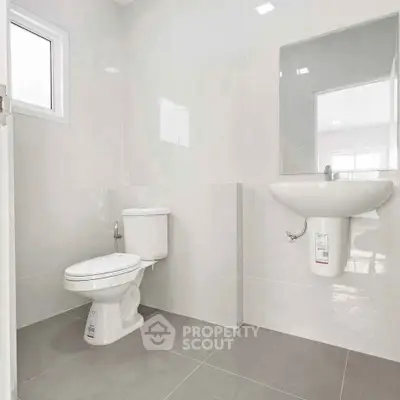 Modern minimalist bathroom with sleek fixtures and neutral tones