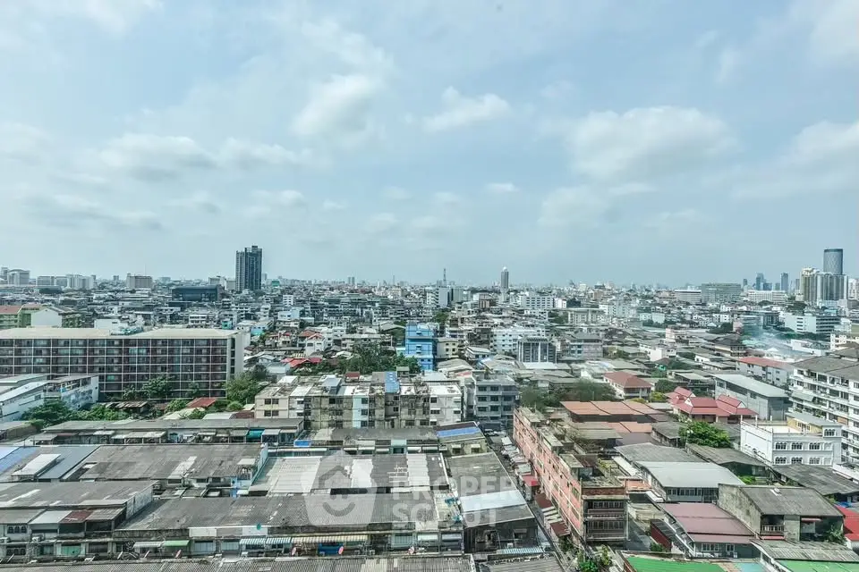 Stunning panoramic cityscape view showcasing urban skyline and diverse architecture under a clear blue sky.