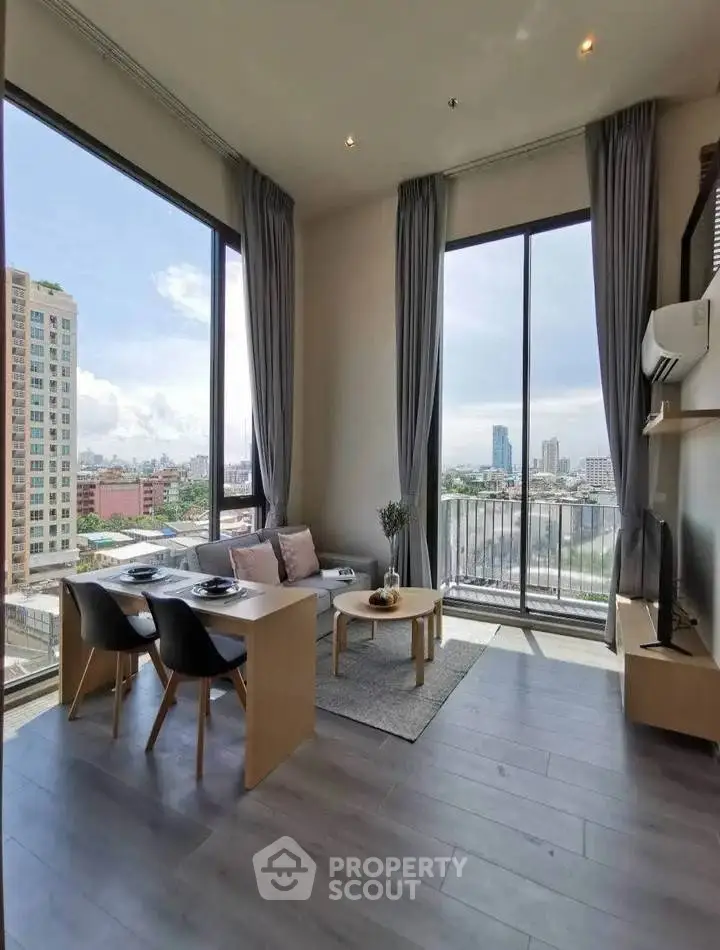 Modern living room with floor-to-ceiling windows and stunning city view