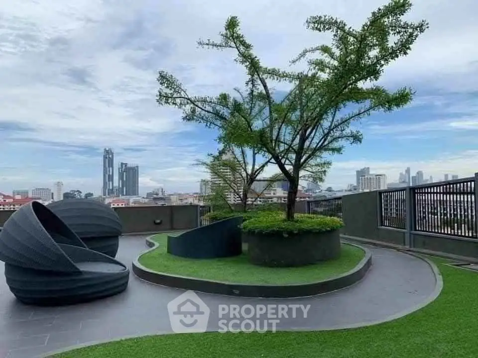 Stunning rooftop garden with modern seating and city skyline views.