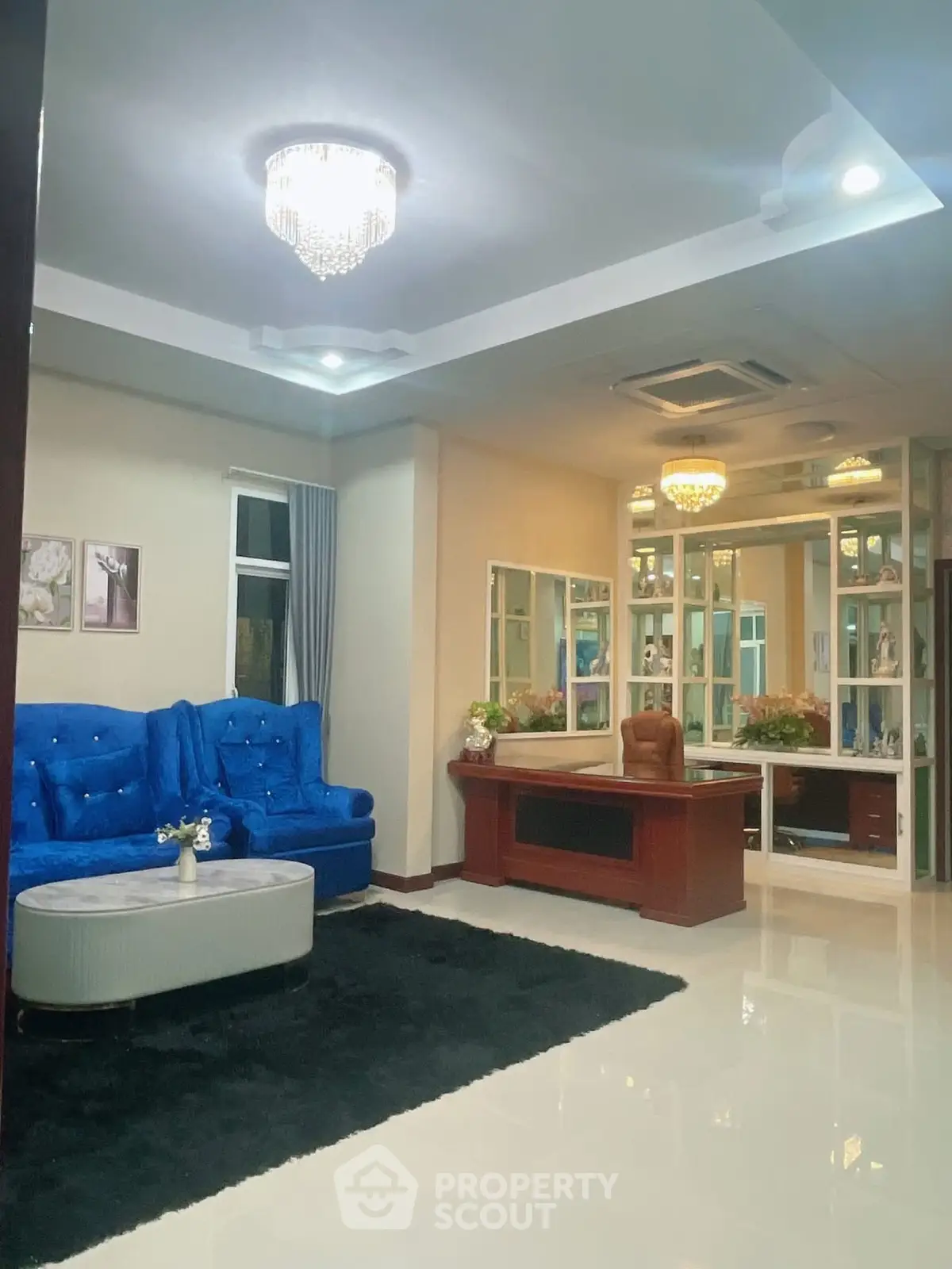 Luxurious living room with elegant blue sofa and modern decor