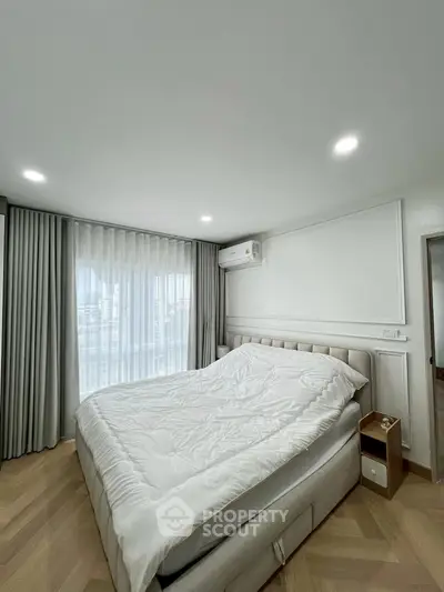 Modern bedroom with elegant decor and natural light