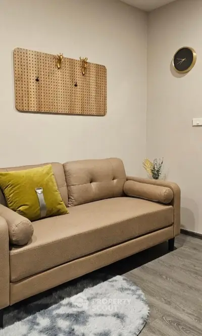 Cozy living room with modern beige sofa and stylish decor