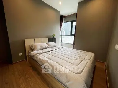 Modern bedroom with large window and cozy bed in urban apartment