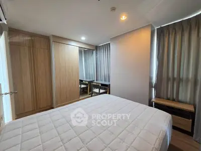 Modern bedroom with wooden wardrobe and cozy lighting in a stylish apartment.