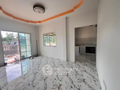 Spacious living room with modern marble flooring and large windows