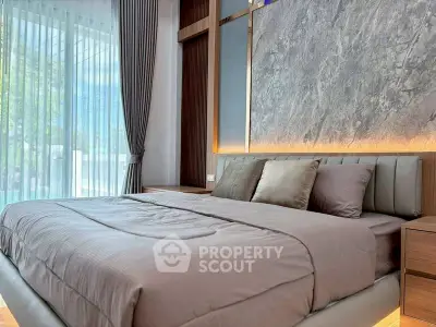 Luxurious modern bedroom with elegant decor and large window view