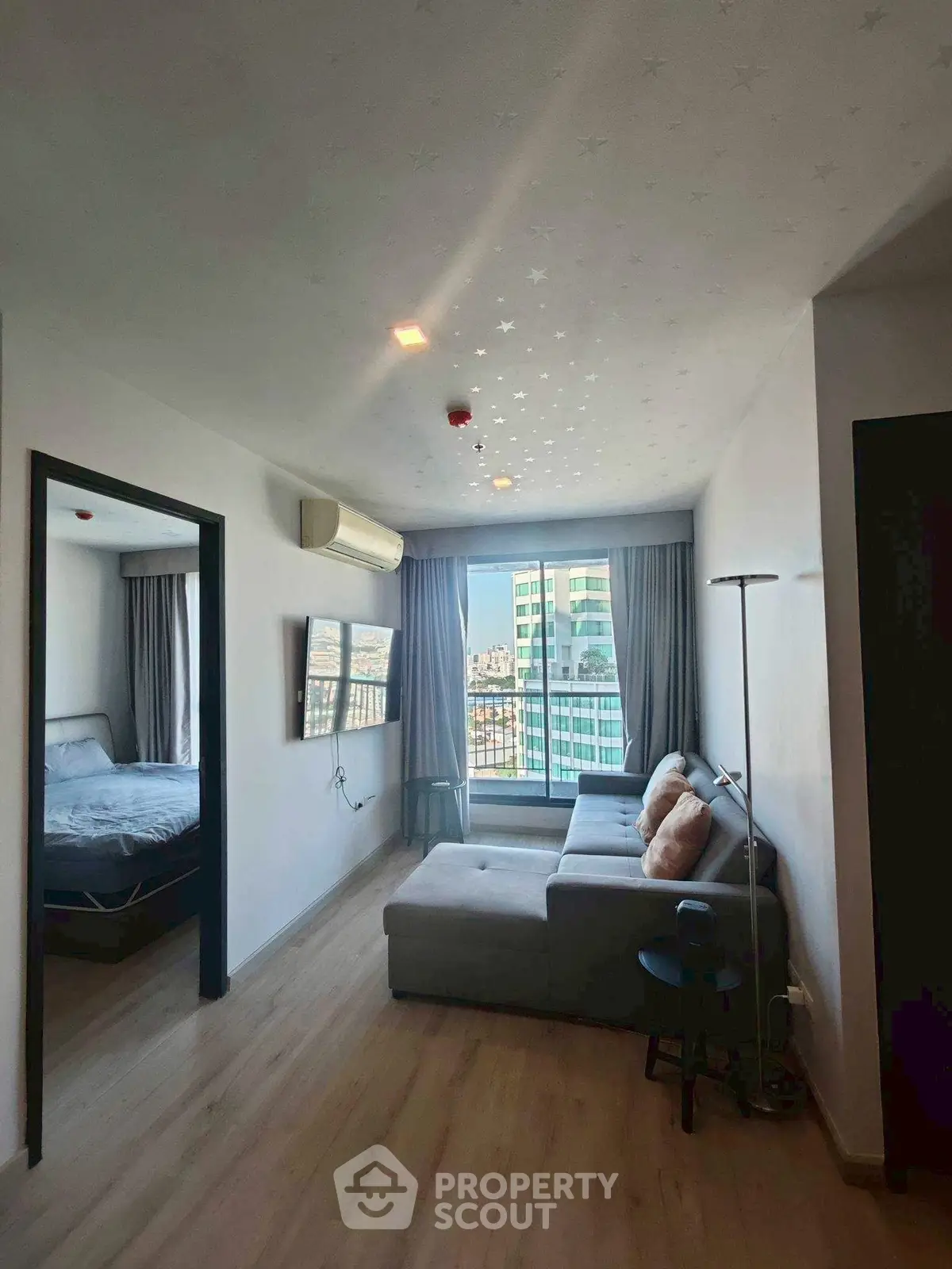 Modern living room with city view and cozy furniture