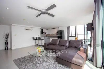 Spacious modern living room with open kitchen and stylish decor
