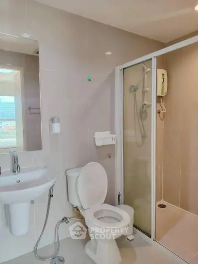 Modern bathroom with shower and toilet in sleek design