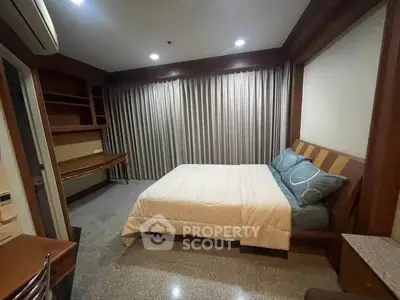 Cozy bedroom with modern decor and ample natural light