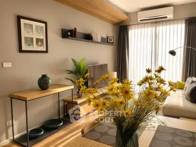 Stylish living room with modern decor, large window, and cozy seating area.