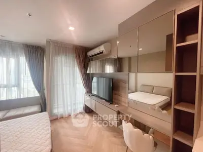Modern bedroom with stylish furniture and large windows for natural light