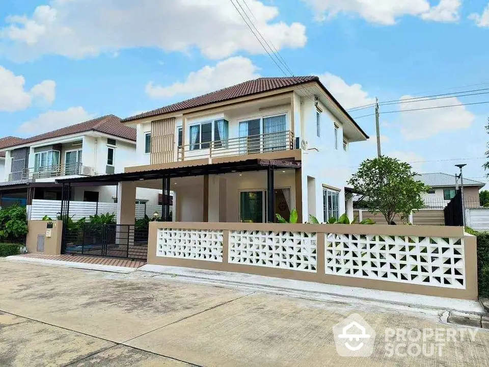 Modern two-story house with spacious driveway and stylish facade in suburban neighborhood.