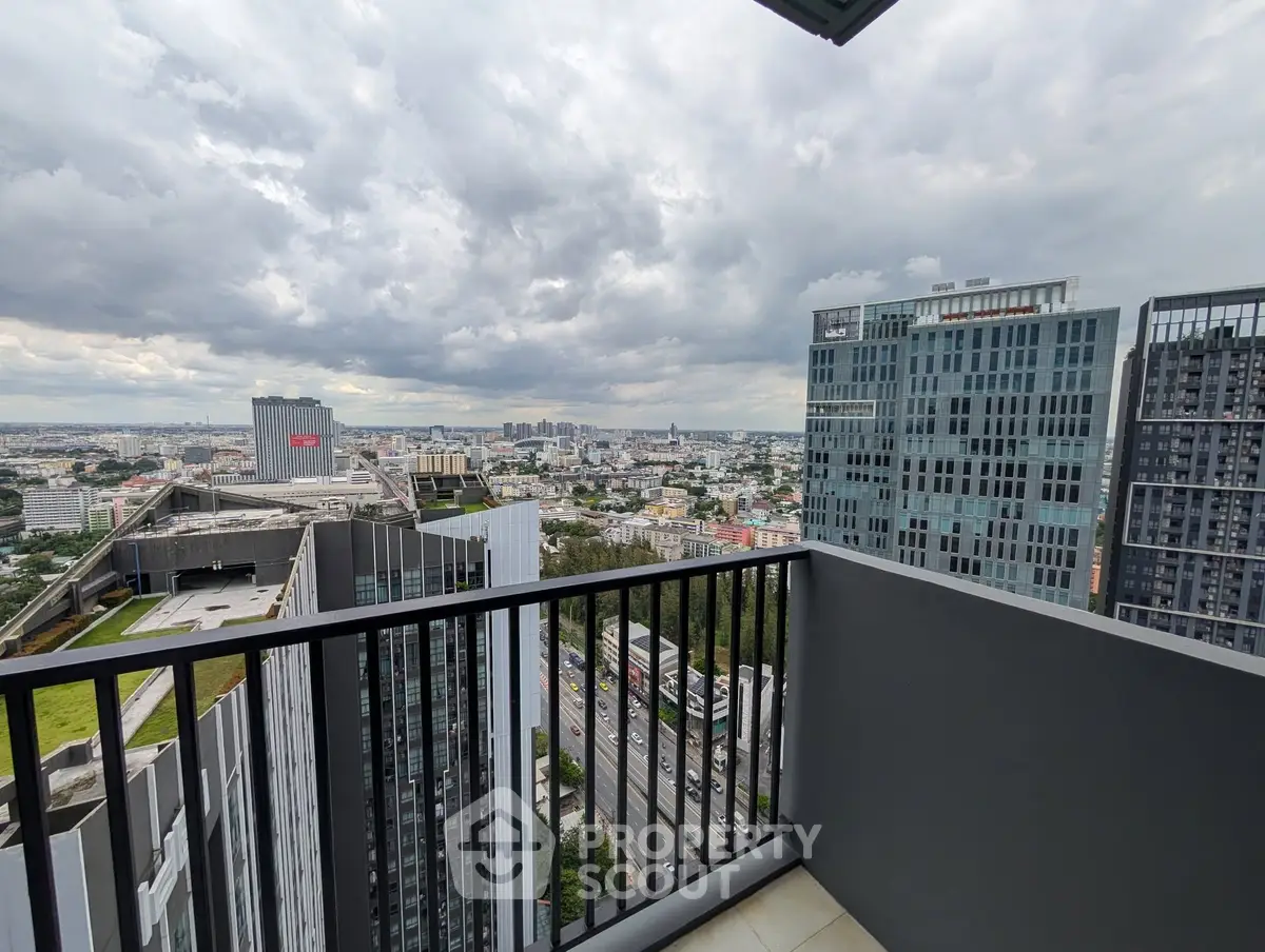 Stunning cityscape view from a modern high-rise balcony, perfect for urban living enthusiasts.