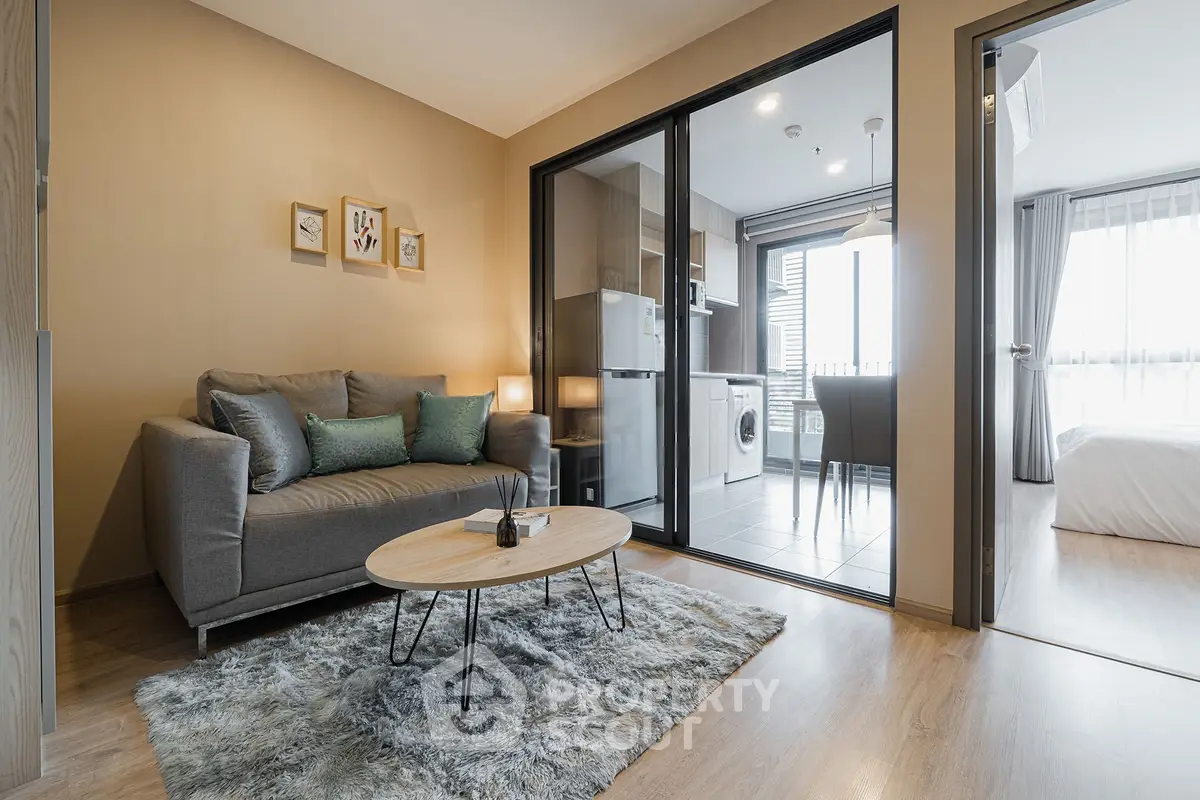 Modern apartment interior with cozy living room and open kitchen layout