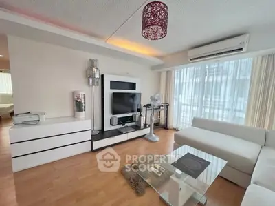 Spacious modern living room with stylish decor and natural light