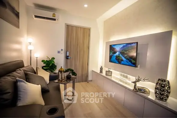 Modern living room with stylish decor and wall-mounted TV, perfect for cozy relaxation.