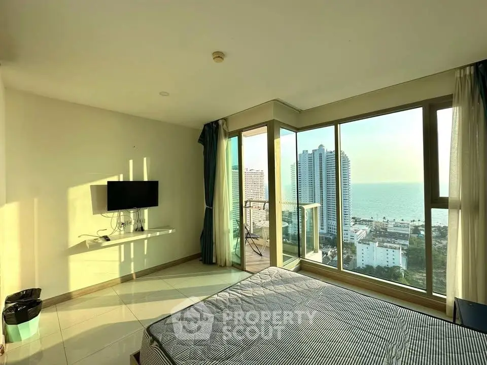 Spacious bedroom with stunning ocean view and large windows