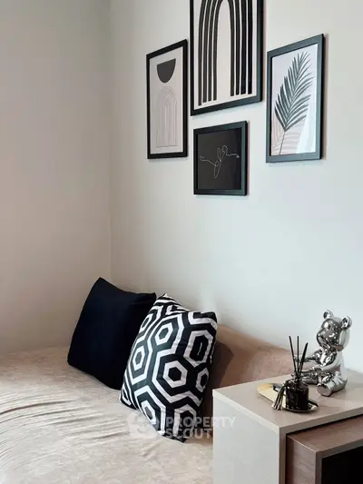Stylish modern living room with geometric art and cozy seating