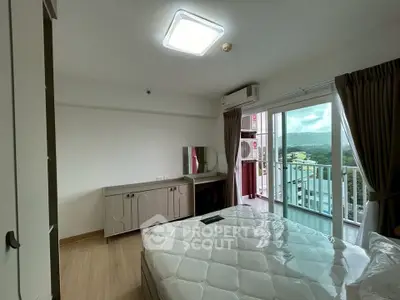 Bright bedroom with balcony and scenic view in modern apartment