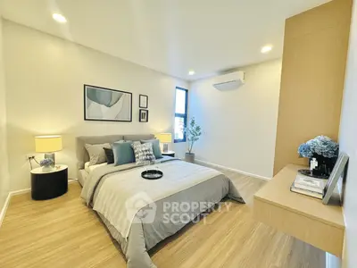 Spacious modern bedroom with elegant decor and natural light